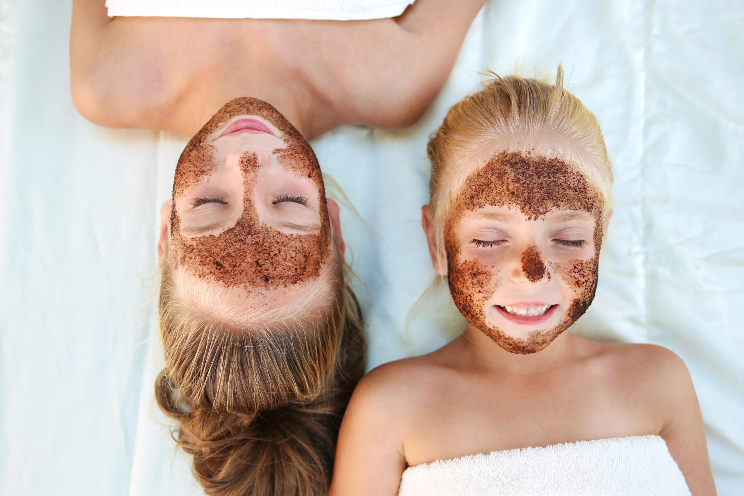 Beautiful,Girls,With,Facial,Mask,Coffee,Scrub.,Top,View.
